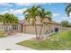 Charming single-story home with a two-car garage, beautiful landscaping, and well-maintained lawn at 2699 Suncoast Lakes Blvd, Punta Gorda, FL 33980