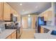 Bright kitchen featuring granite countertops, black appliances, and lots of storage at 2699 Suncoast Lakes Blvd, Punta Gorda, FL 33980