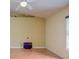 An empty living room showcases beautiful wood floors and a ceiling fan, ready for personalization at 2699 Suncoast Lakes Blvd, Punta Gorda, FL 33980