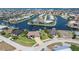 Waterfront property featuring beautiful landscaping, a private dock, and an expansive view of intersecting canals at 2850 Magdalina Dr, Punta Gorda, FL 33950