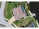 An aerial shot highlights the home's layout, landscaping, screened pool, and canal access with a boat dock at 2850 Magdalina Dr, Punta Gorda, FL 33950