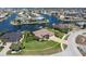 Stunning aerial shot of a waterfront property with lush landscaping and a private dock at 2850 Magdalina Dr, Punta Gorda, FL 33950