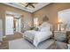 Charming bedroom with a tray ceiling, wood floors, and lots of natural light at 2850 Magdalina Dr, Punta Gorda, FL 33950