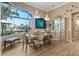 Bright dining area with waterfront views, decorative light fixtures, and coastal decor at 2850 Magdalina Dr, Punta Gorda, FL 33950