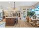An open-concept kitchen flows seamlessly into the dining area, offering stainless steel appliances and waterfront views at 2850 Magdalina Dr, Punta Gorda, FL 33950