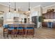 Gourmet kitchen with stainless steel appliances, a center island, and custom cabinetry with ample storage at 2850 Magdalina Dr, Punta Gorda, FL 33950