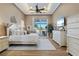 Elegant main bedroom with high tray ceilings, ceiling fan and a large dresser at 2850 Magdalina Dr, Punta Gorda, FL 33950