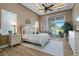 Elegant main bedroom features a ceiling fan, sliding glass doors, and neutral colors at 2850 Magdalina Dr, Punta Gorda, FL 33950