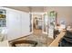Bright and organized office space, featuring a desk, built-in shelves, and open doorway to the living room at 2850 Magdalina Dr, Punta Gorda, FL 33950