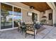Inviting outdoor living space featuring a summer kitchen, comfortable seating, and elegant ceiling fans at 2850 Magdalina Dr, Punta Gorda, FL 33950