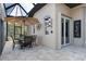 Relaxing screened-in patio with elegant dining set and neutral color scheme at 2850 Magdalina Dr, Punta Gorda, FL 33950