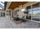 Covered outdoor patio with comfortable seating and a TV at 2850 Magdalina Dr, Punta Gorda, FL 33950