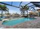 Screened-in pool with a tranquil canal view, ample seating, and a relaxing outdoor living space at 2850 Magdalina Dr, Punta Gorda, FL 33950