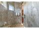 Walk-in shower with marble tile and pebble floor at 2850 Magdalina Dr, Punta Gorda, FL 33950