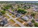 Overhead view of homes with manicured lawns and mature trees creating a pleasant suburban setting at 3078 Mancini Ter, Punta Gorda, FL 33983