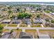 Aerial of a well-maintained neighborhood, featuring lovely homes and community landscaping at 3078 Mancini Ter, Punta Gorda, FL 33983