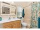 Bathroom with shower, single sink vanity, and decorative shower curtain at 3078 Mancini Ter, Punta Gorda, FL 33983