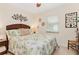 Welcoming bedroom with tropically themed decor and a ceiling fan at 3078 Mancini Ter, Punta Gorda, FL 33983