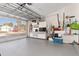 Spacious garage featuring ample storage, work area, and natural light from the screened garage door at 3078 Mancini Ter, Punta Gorda, FL 33983