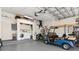 Garage with laundry area, utility sink, upper storage, and plenty of room for parking and hobbies at 3078 Mancini Ter, Punta Gorda, FL 33983