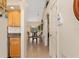 Inviting hallway leading to the dining area, featuring tile flooring and neutral paint at 3078 Mancini Ter, Punta Gorda, FL 33983