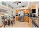Functional kitchen featuring stainless steel appliances and a breakfast table by the window at 3078 Mancini Ter, Punta Gorda, FL 33983