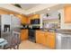 Bright kitchen with stainless steel appliances and a pass-through to the lanai at 3078 Mancini Ter, Punta Gorda, FL 33983