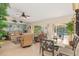 Bright living and dining area with tile floors, ceiling fan, and views of the pool at 3078 Mancini Ter, Punta Gorda, FL 33983