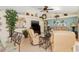 Open living room featuring a TV, fireplace, and elegant decor at 3078 Mancini Ter, Punta Gorda, FL 33983
