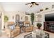 Comfortable living room with tile flooring, ceiling fan, and neutral decor at 3078 Mancini Ter, Punta Gorda, FL 33983