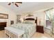 Well-lit bedroom with decorative headboard and comfortable furniture at 3078 Mancini Ter, Punta Gorda, FL 33983