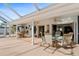 Large covered patio with multiple seating areas perfect for entertaining guests and outdoor dining at 3078 Mancini Ter, Punta Gorda, FL 33983