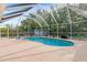 Screened in pool area with lush landscaping and plenty of room for outdoor entertaining at 3078 Mancini Ter, Punta Gorda, FL 33983
