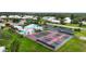 Overhead view of the community center near the tennis and pickleball courts and swimming pool at 3287 Meadow Run Cir, Venice, FL 34293