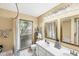 Bathroom with double sinks, nautical decor, and a shower/tub combo at 3287 Meadow Run Cir, Venice, FL 34293