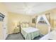 Cozy bedroom with a twin bed, soft colors, and natural light streaming through the window at 3287 Meadow Run Cir, Venice, FL 34293