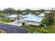 Aerial view of the East Village Center featuring pristine landscaping and a welcoming entrance at 3287 Meadow Run Cir, Venice, FL 34293