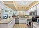 Bright kitchen features granite countertops, stainless steel appliances, and an open layout at 3287 Meadow Run Cir, Venice, FL 34293