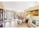 Open-concept living area with stylish furnishings and plenty of natural light at 3287 Meadow Run Cir, Venice, FL 34293