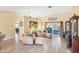 Bright living room with hardwood floors and a cozy seating area at 3287 Meadow Run Cir, Venice, FL 34293
