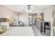 Spacious main bedroom with a ceiling fan, sitting area, and ensuite bathroom at 3287 Meadow Run Cir, Venice, FL 34293