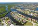 Waterfront community aerial view shows winding canals, lush mangroves and the home's prime location at 347 Portofino Dr, Punta Gorda, FL 33950