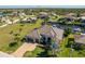 Aerial view showcasing the home, lush landscaping, and waterfront location at 347 Portofino Dr, Punta Gorda, FL 33950