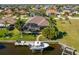 Aerial view features home with a screened pool, boat dock, and canal access at 347 Portofino Dr, Punta Gorda, FL 33950