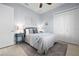 Cozy bedroom featuring a comfortable queen bed, decorative wall art, and ample closet space at 347 Portofino Dr, Punta Gorda, FL 33950