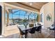 Screened lanai features a dining table, ceiling fan, and views of the pool and waterfront at 347 Portofino Dr, Punta Gorda, FL 33950