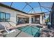 A gorgeous backyard pool and spa are surrounded by covered patio seating areas at 347 Portofino Dr, Punta Gorda, FL 33950