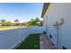 Enclosed side yard with low-maintenance landscaping and privacy fencing at 347 Portofino Dr, Punta Gorda, FL 33950