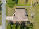 Aerial view of a single-Gathering home showing the roof, driveway, and surrounding landscape at 3614 January Ave, North Port, FL 34288