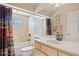Bright bathroom featuring a full tub and shower with tile surround at 3614 January Ave, North Port, FL 34288
